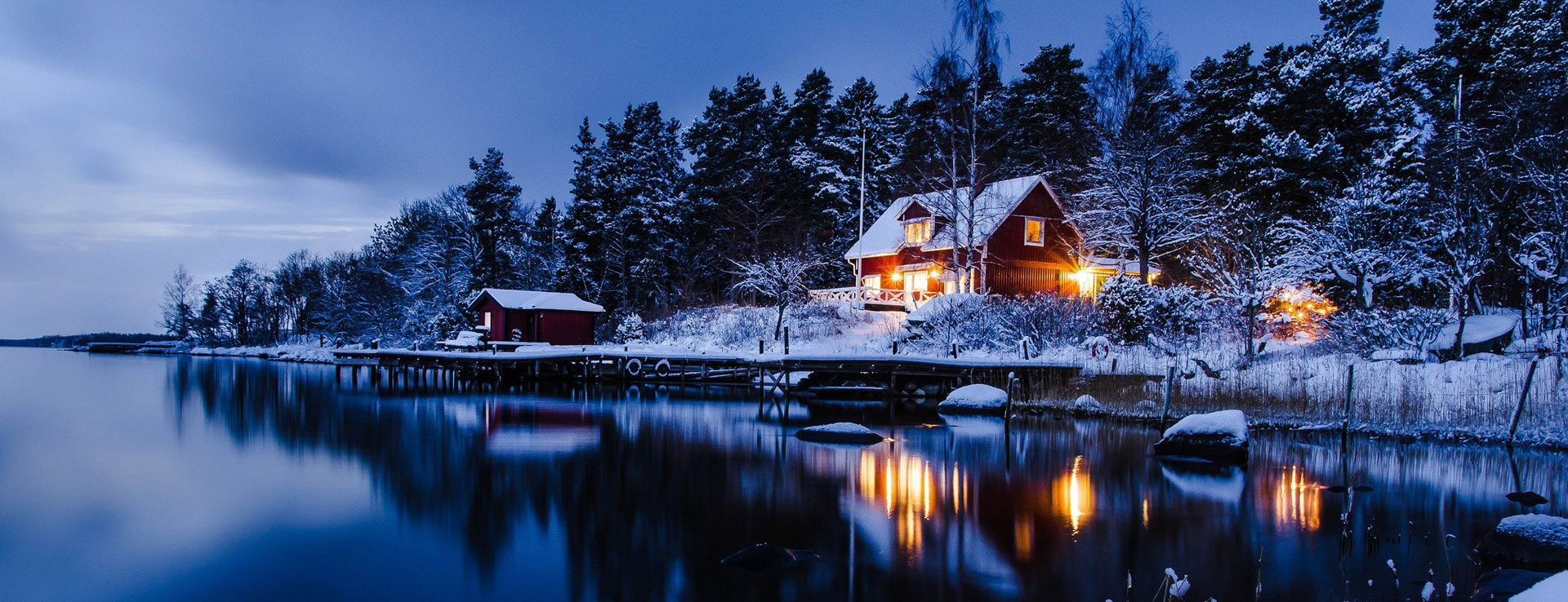 forest-houses-lights-snow-sweden-winter